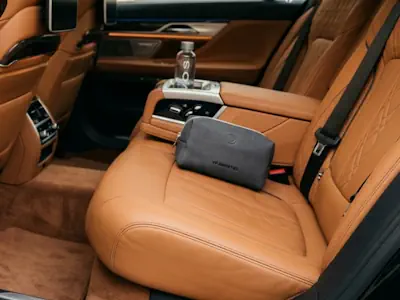 Luxury umbrella and hygiene kit prepared for guests in a BMW 7 Series