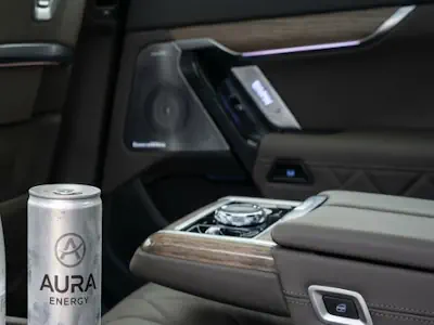 Chilled still and sparkling water provided for passengers in a BMW i7 chauffeur service.