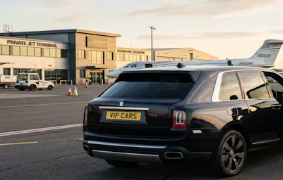Our Rolls-Royce Cullinan chauffeur service providing professional airport transfers at a private terminal.