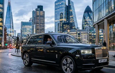 Professional business travel using our Rolls-Royce Cullinan chauffeur service in the city.
