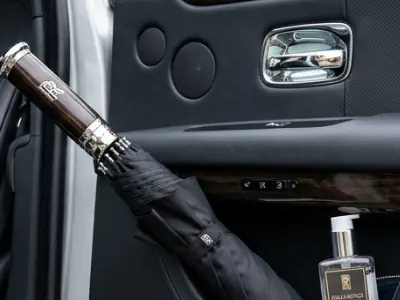 A classic umbrella and hygiene kit ready for guests in a Rolls-Royce Ghost