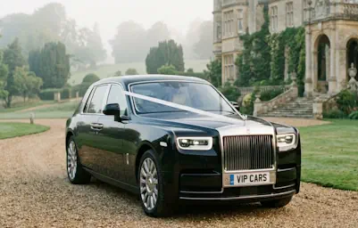 Elegant Rolls-Royce Phantom decorated for a luxury wedding.